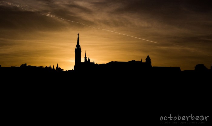 sunset behind matthais church, from the banks of the danube